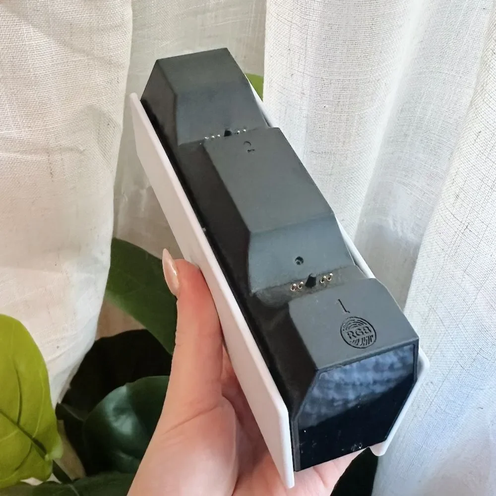 White and Black PS Controller Charging Dock